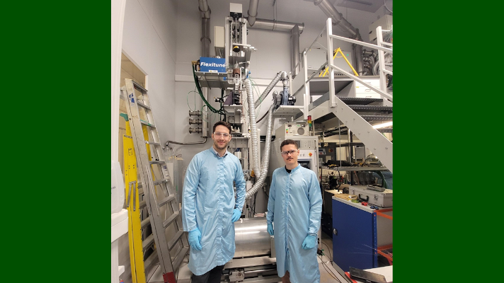 Nicolas Darras (right) spictured here with colleague Dr Bruno Moog (left) at the drawing tower for manufacturing glass fibres University of Southampton